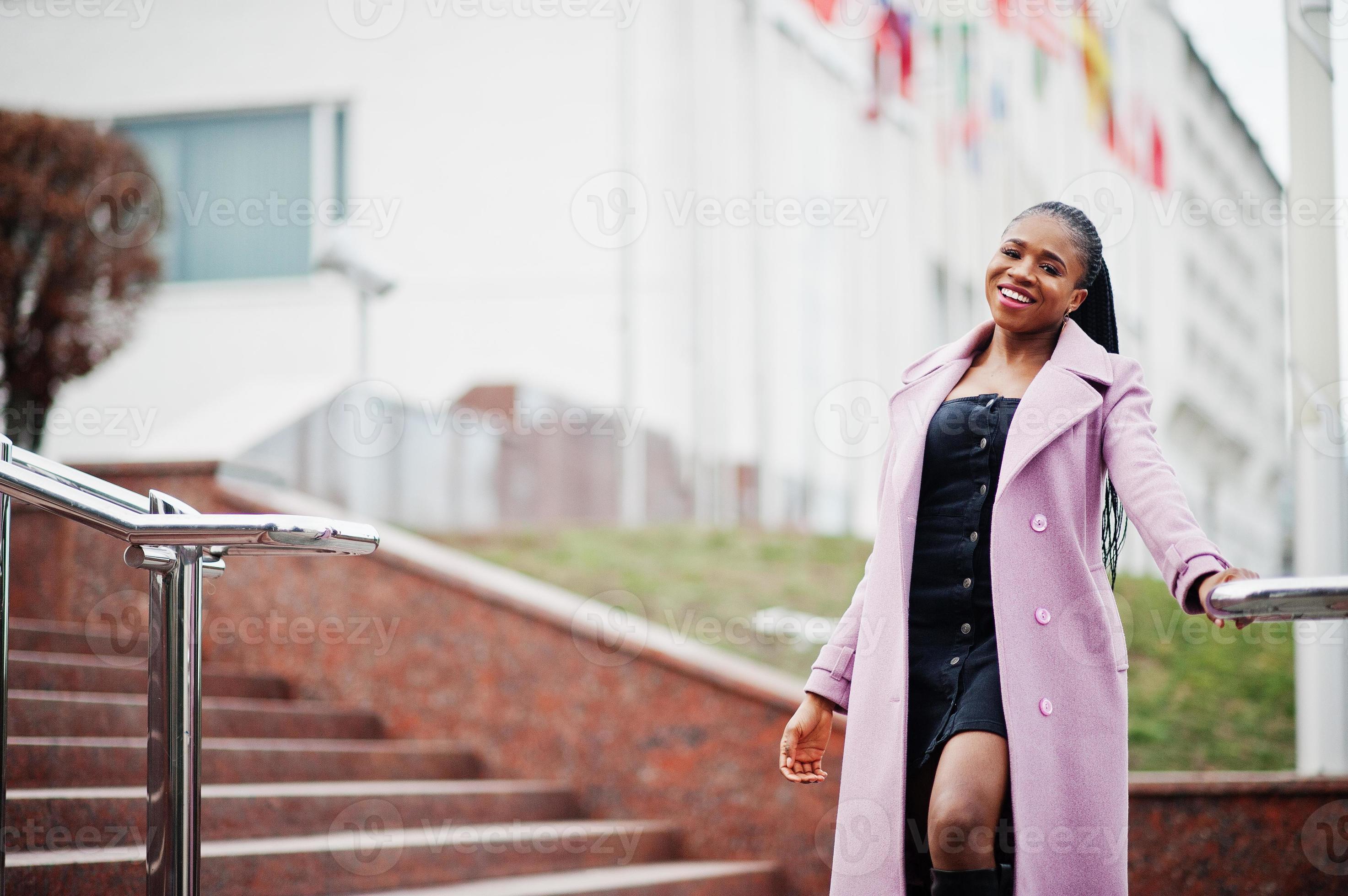 Young stylish beautiful african american woman in street, wearing