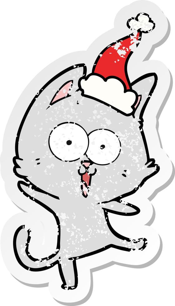 funny distressed sticker cartoon of a cat wearing santa hat vector