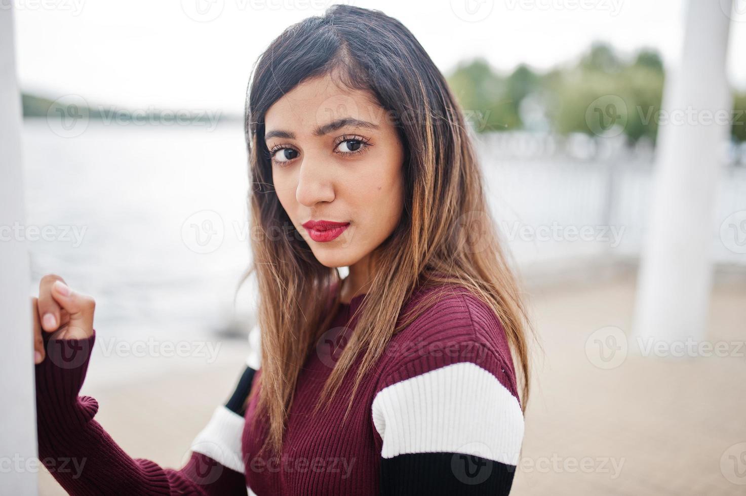 Close up portrait of young beautiful indian or south asian teenage girl in dress. photo