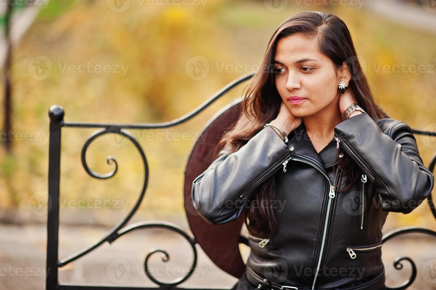 Pretty indian girl in black saree dress and leather jacket posed ...