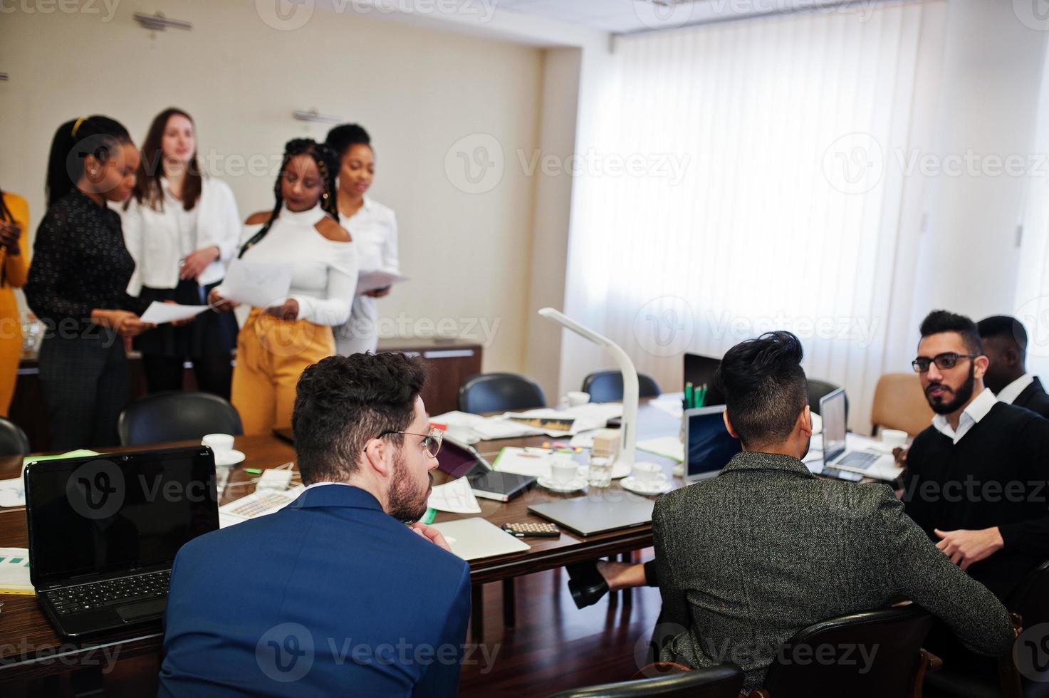 Diverse business people on a meeting at round table. photo