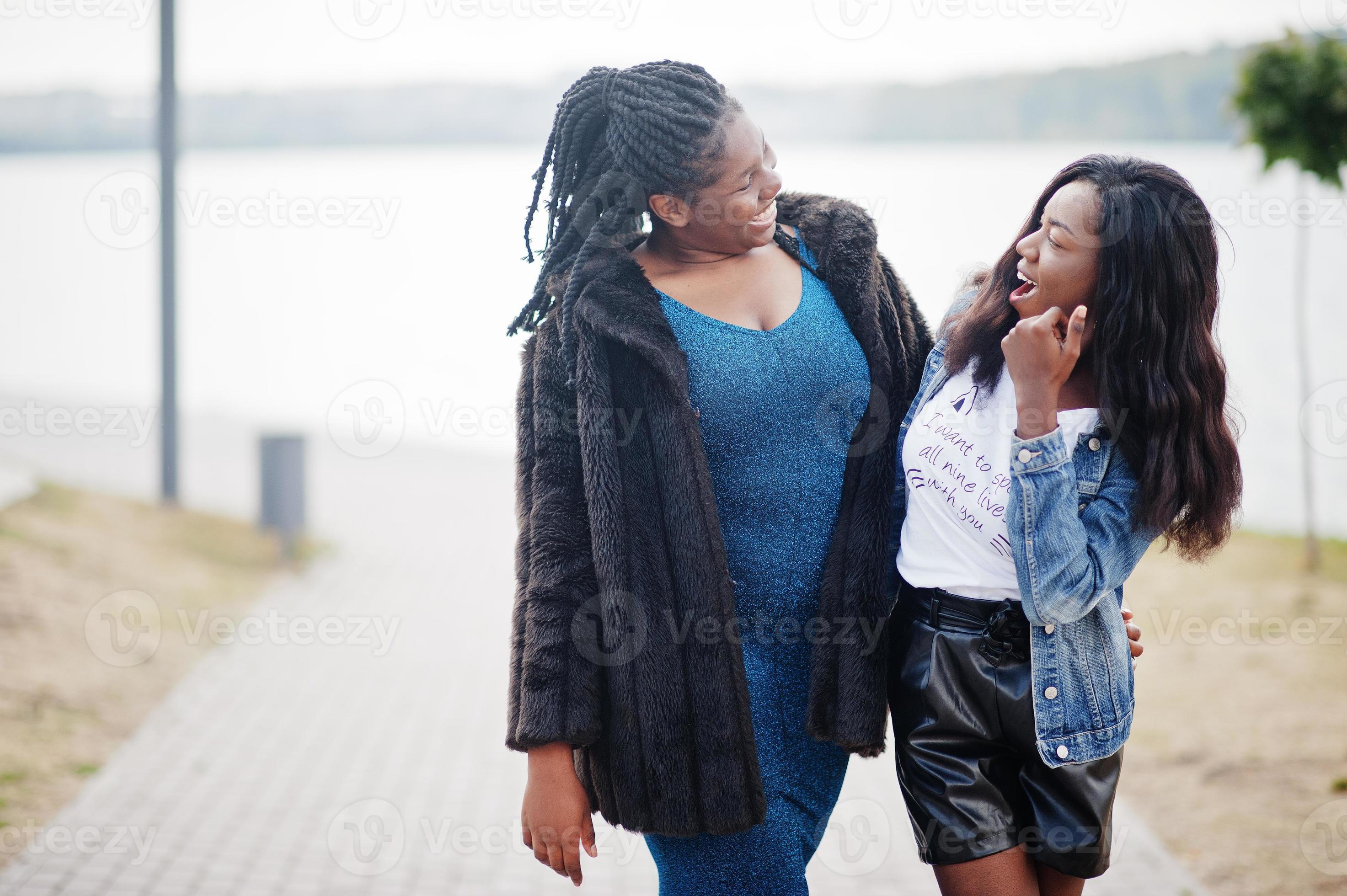Two african american dark skinned friends female. One of them plus size