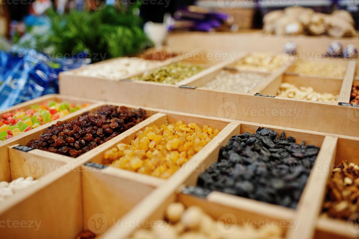 Raisins, nuts and candied fruits on the shelf of a supermarket or