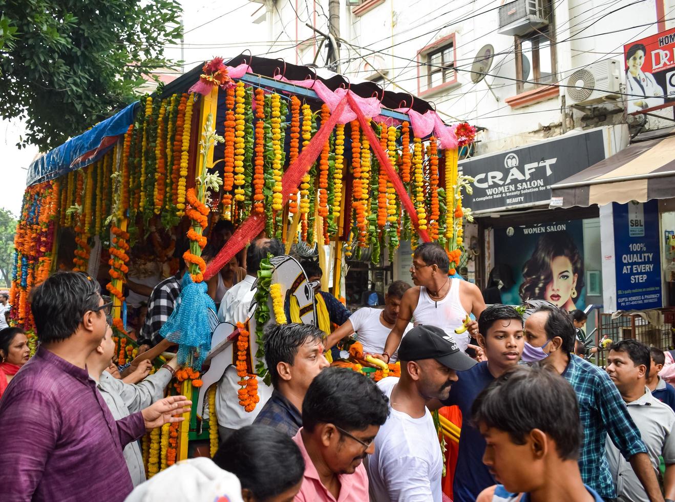 New Delhi, India July 01 2022 - A huge gathering of devotees from different parts of Delhi on the occasion of ratha yatra or rathyatra. Rath for Lord Jagannath pulled by people, Jagannath Rath Yatra photo