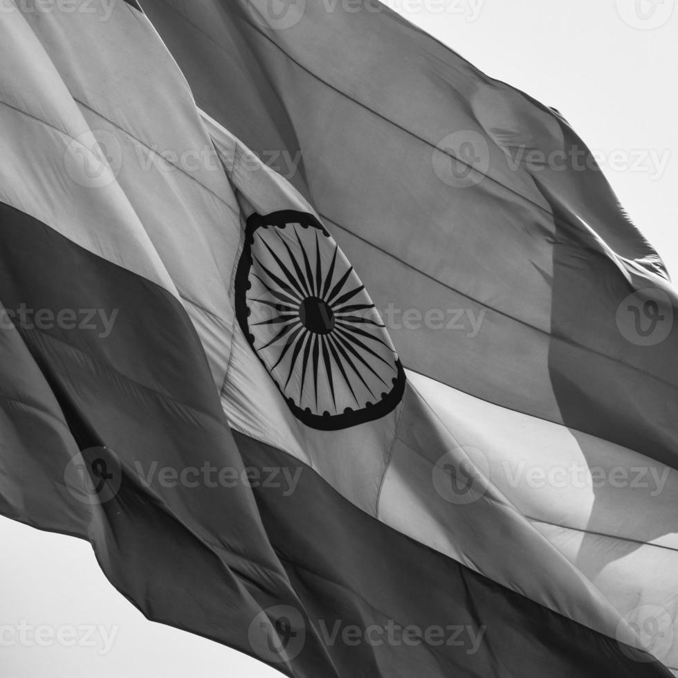 India flag flying at Connaught Place with pride in blue sky, India flag fluttering, Indian Flag on Independence Day and Republic Day of India, waving Indian flag, Flying India flags - Black and White photo