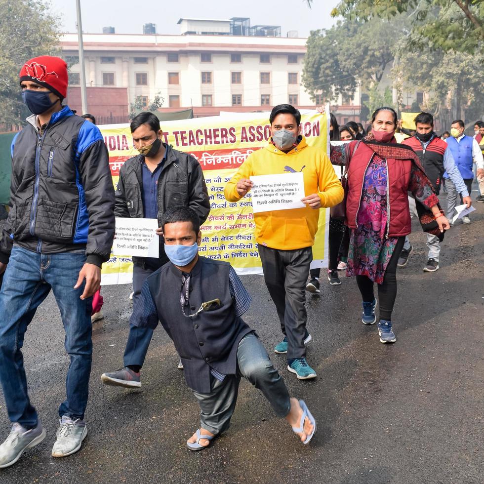 New Delhi, India December 25 2021 - Delhi Contractual Guest Teachers with posters, flags and graffitis protesting against Delhi AAP Government for making policy, Delhi Guest Teachers protesting photo