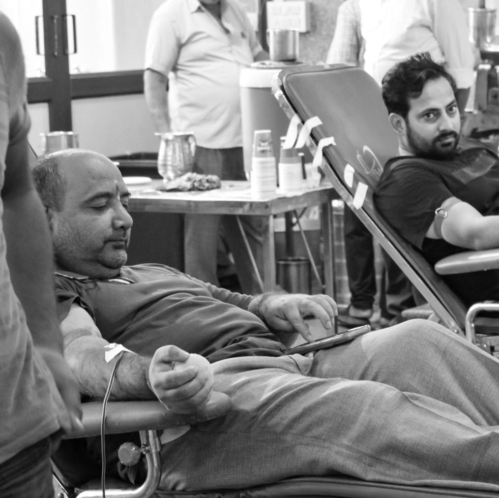 Delhi, India, June 19 2022 - Blood donor at Blood donation camp held at Balaji Temple, Vivek Vihar, Delhi, India, Image for World blood donor day on June 14 every year, Blood Donation Camp at Temple photo