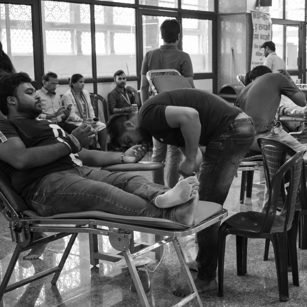 Delhi, India, June 19 2022 - Blood donor at Blood donation camp held at Balaji Temple, Vivek Vihar, Delhi, India, Image for World blood donor day on June 14 every year, Blood Donation Camp at Temple photo
