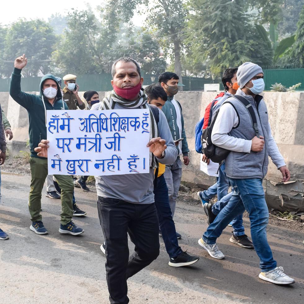 New Delhi, India December 25 2021 - Delhi Contractual Guest Teachers with posters, flags and graffitis protesting against Delhi AAP Government for making policy, Delhi Guest Teachers protesting photo