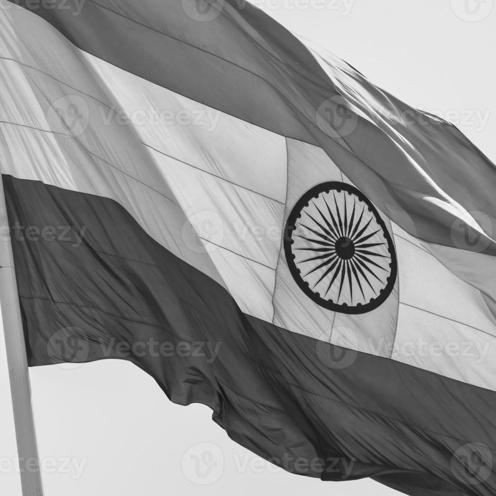 India flag flying at Connaught Place with pride in blue sky, India flag fluttering, Indian Flag on Independence Day and Republic Day of India, waving Indian flag, Flying India flags - Black and White photo