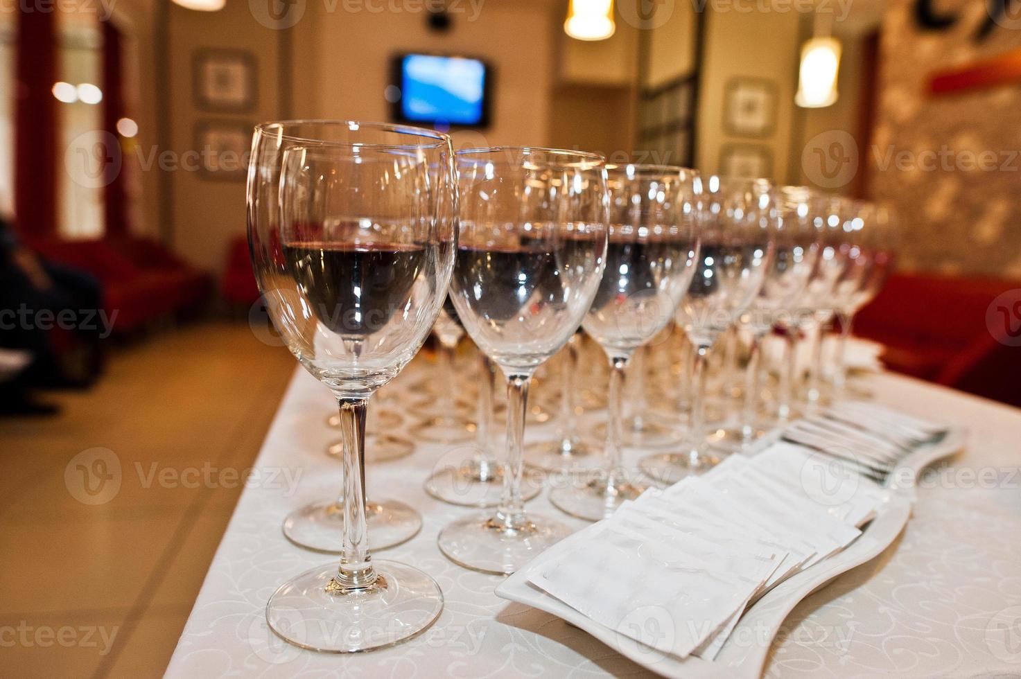 Different alcohol beverages in glasses on the table in restaurant or bar. photo