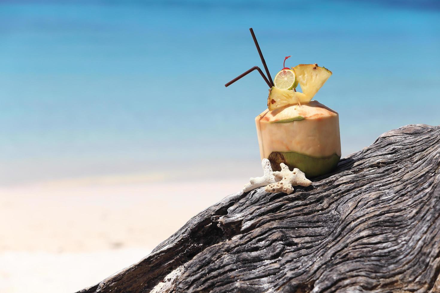 Coconut cocktail on the beach photo