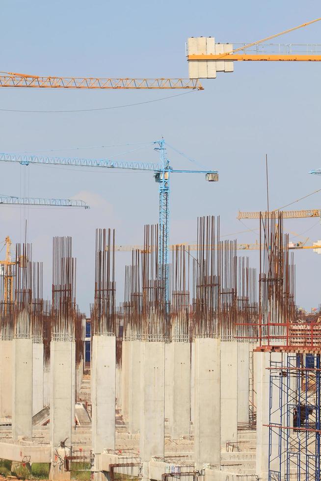 Construction site with enforced concrete steel frames rising up photo