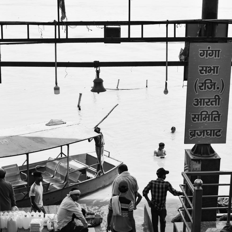 Garh Mukteshwar, UP, India, June 11 2022 -People are taking holy dip on the occasion of Nirjala Ekadashi, A view of Garh Ganga Brij ghat which is very famous religious place for Hindus-Black and White photo