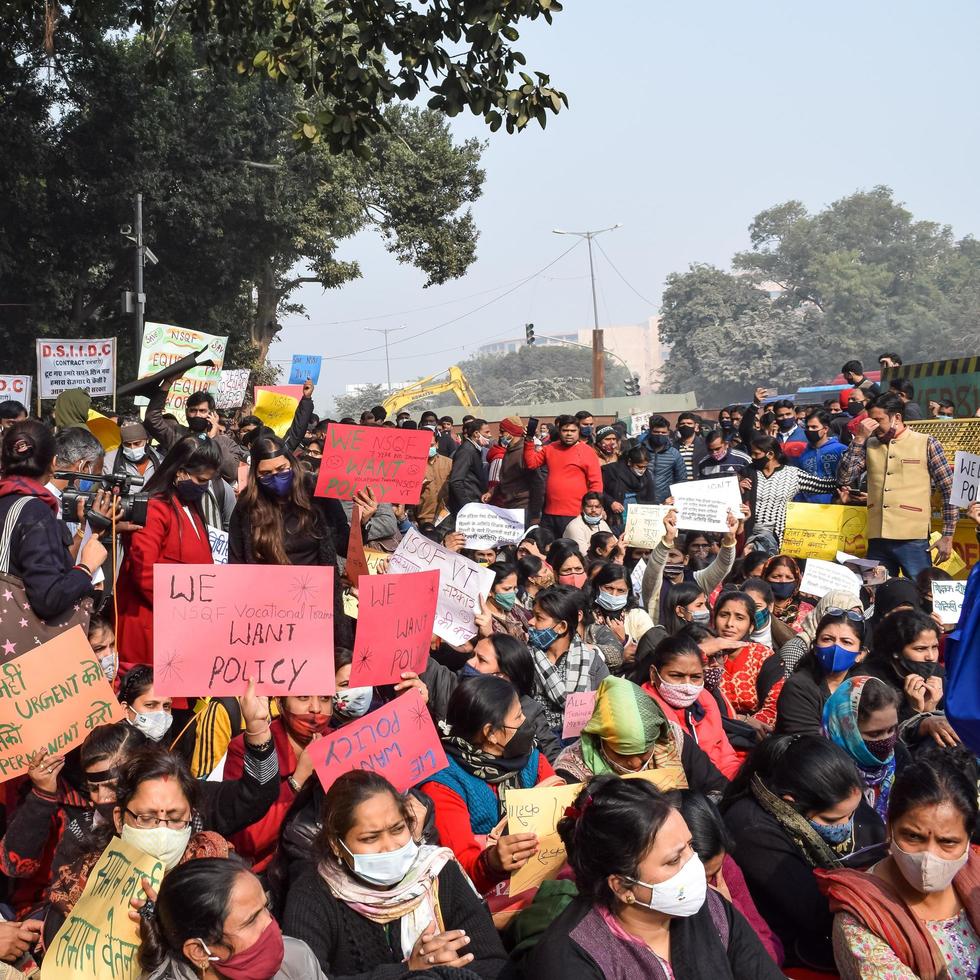 New Delhi, India December 25 2021 - Delhi Contractual Guest Teachers with posters, flags and graffitis protesting against Delhi AAP Government for making policy, Delhi Guest Teachers protesting photo