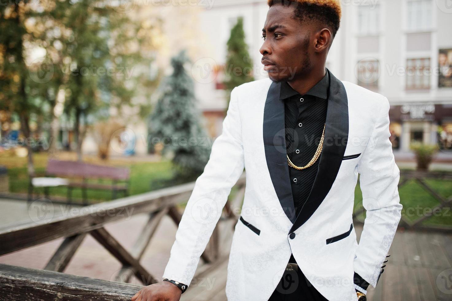 Chic handsome african american man in white suit. photo