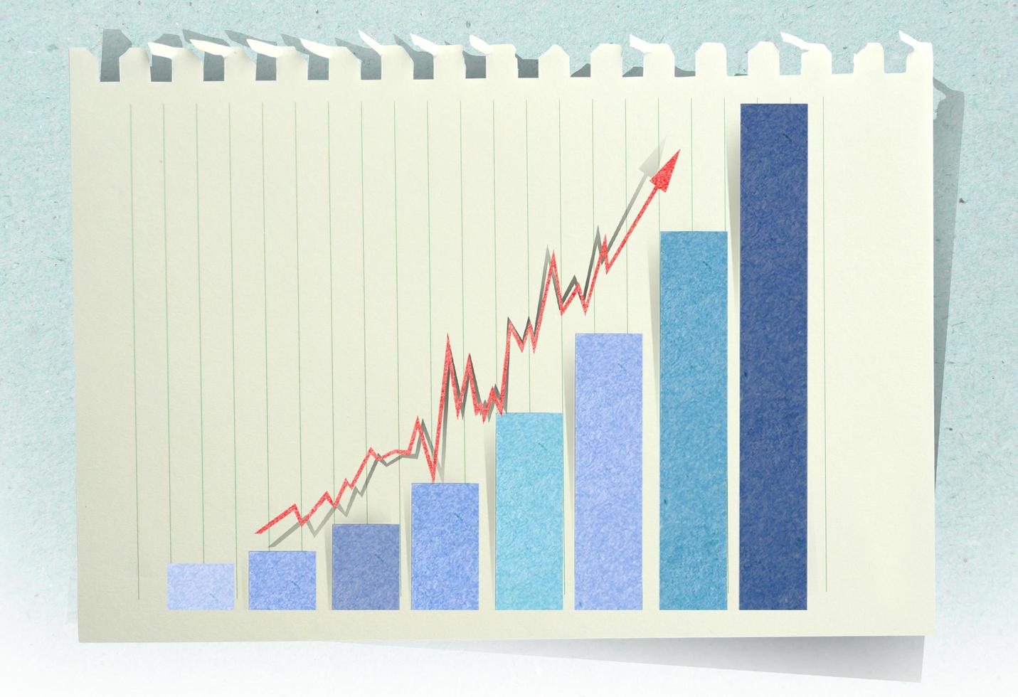 Conceptual Business charts with staple recycled paper craft stick photo