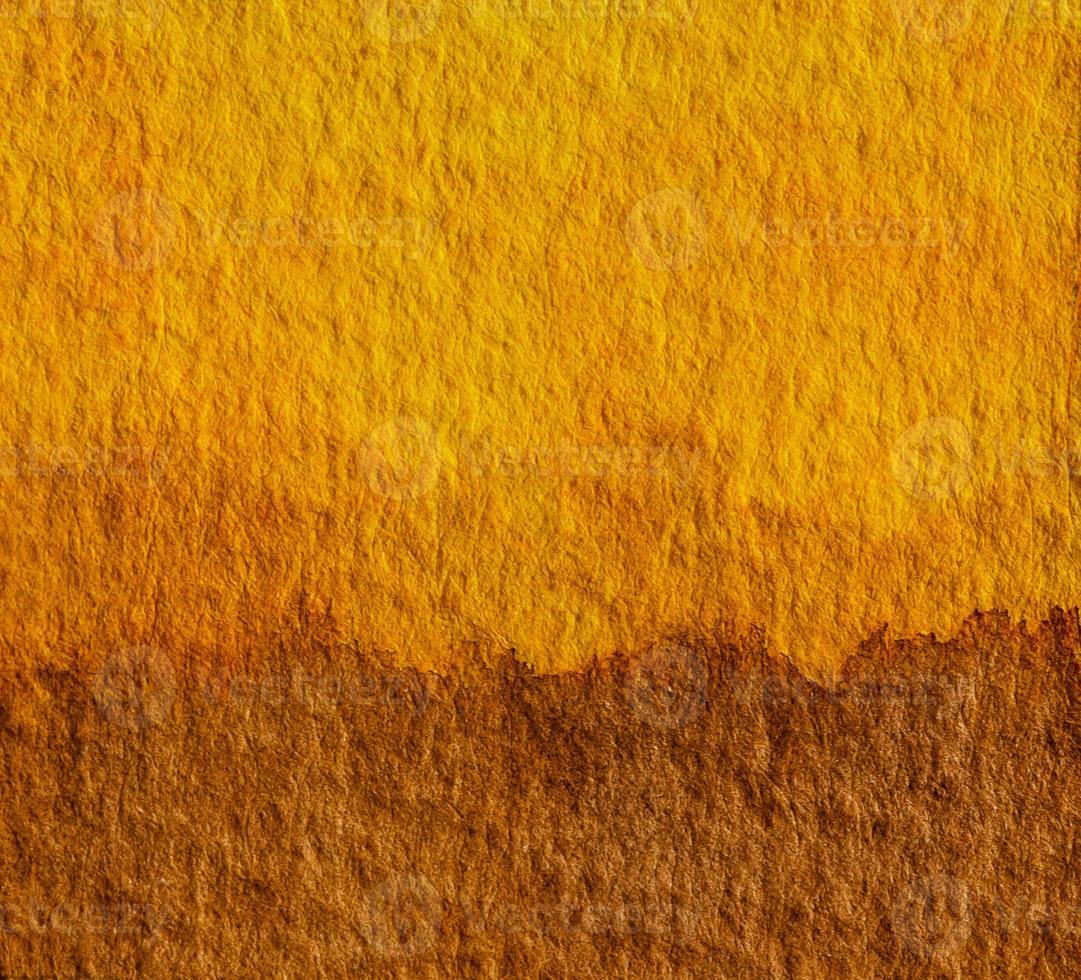 Yellow and brown watercolor hand painting art background. Earth tone concept for natural colors of ground or soil. photo