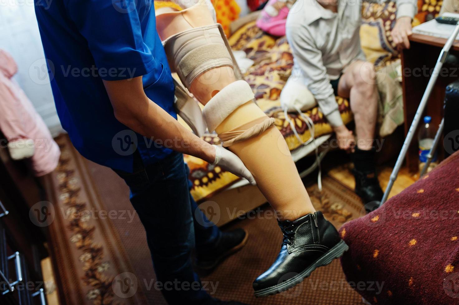 The prosthetist removes the measure from a person with a disability, man with amputee. photo