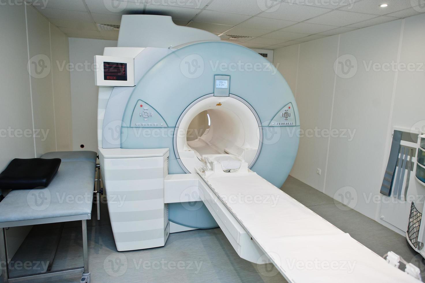 Magnetic resonance imaging scan or MRI machine device in hospital. photo