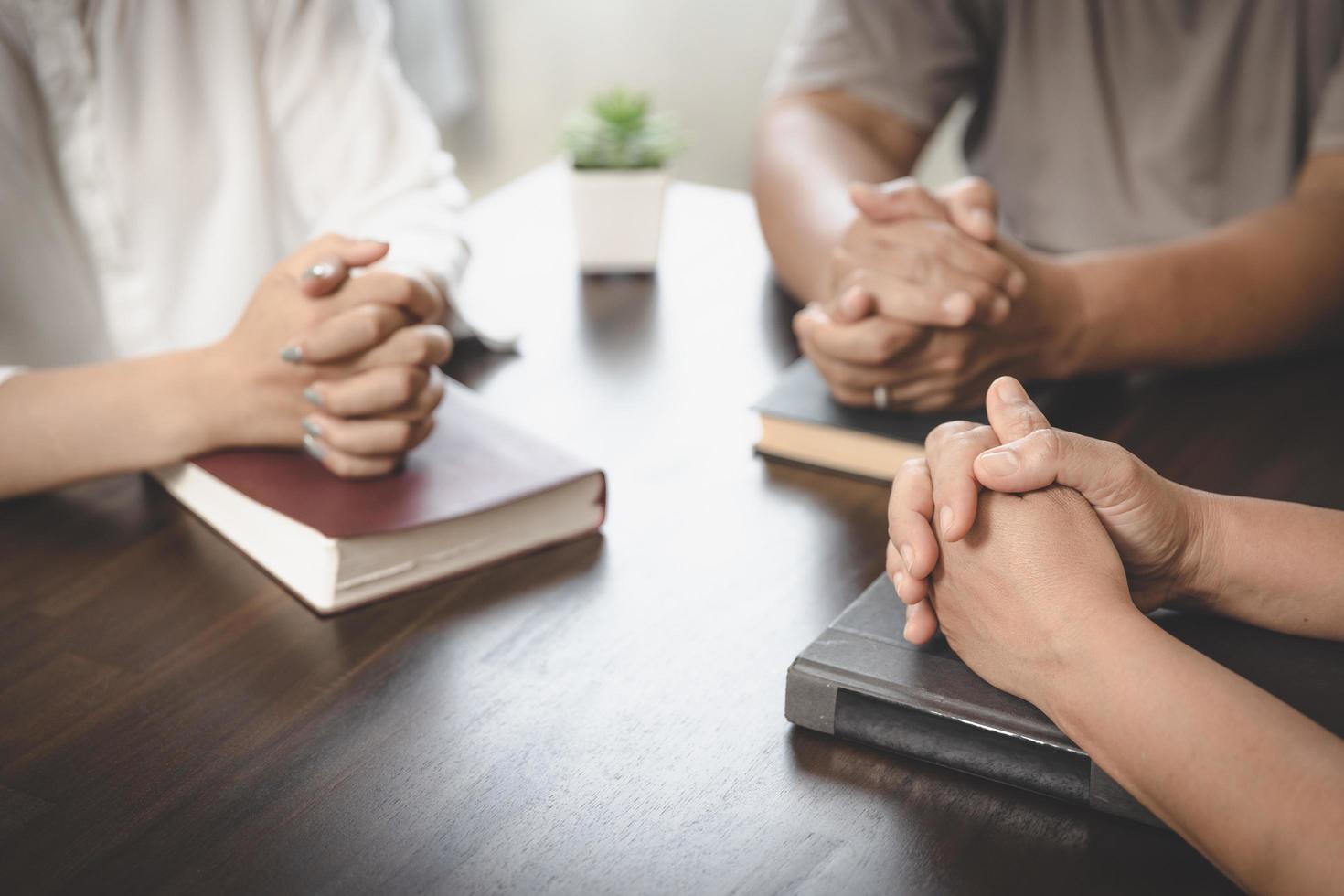 Asian Christian groups sitting within the Church Catholic prayed for blessings from God. A pale sun shone in a place of worship.Religious concepts. photo