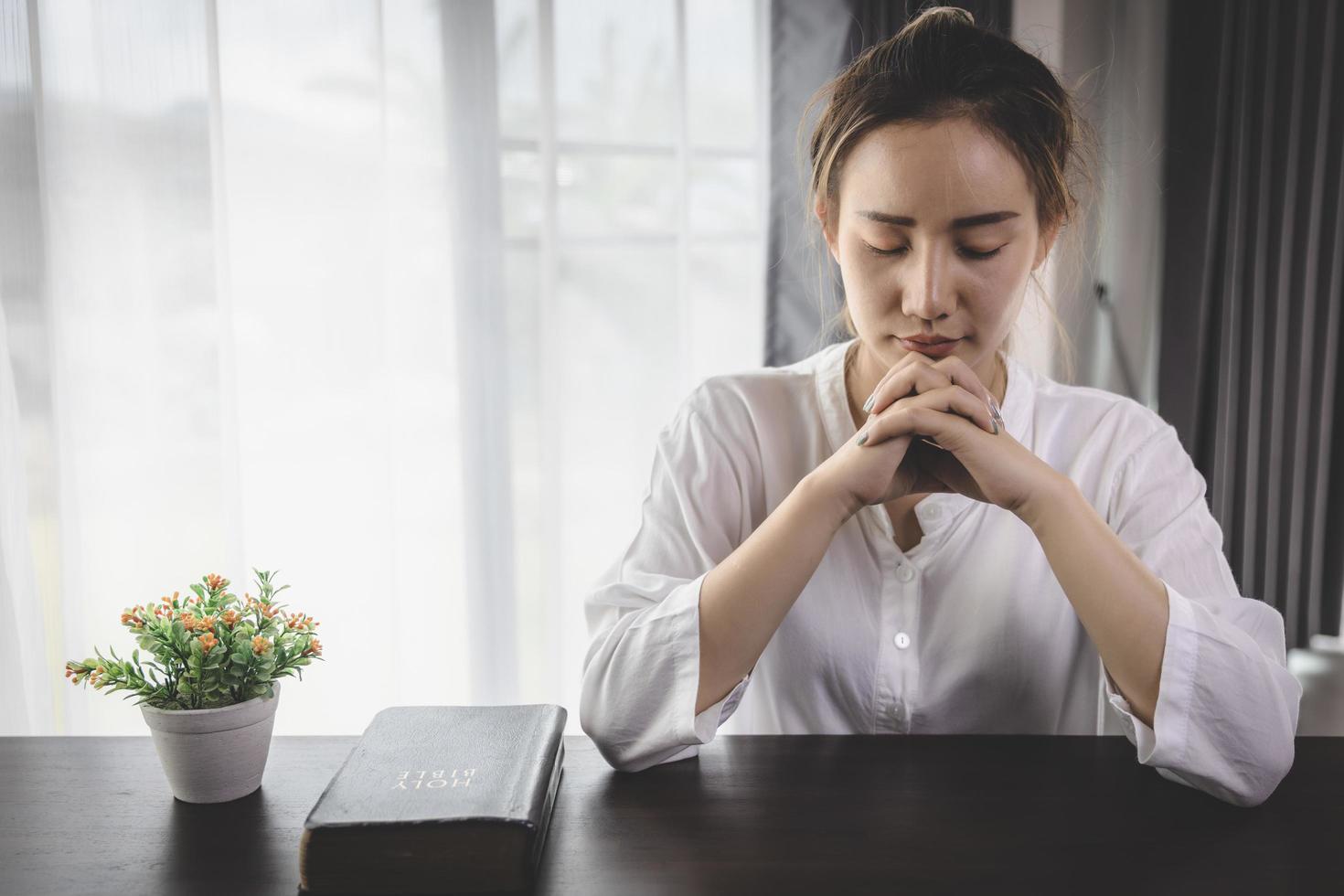 Woman hands praying for blessing from god. Praying hands with faith in religion and belief in God on blessing background. photo