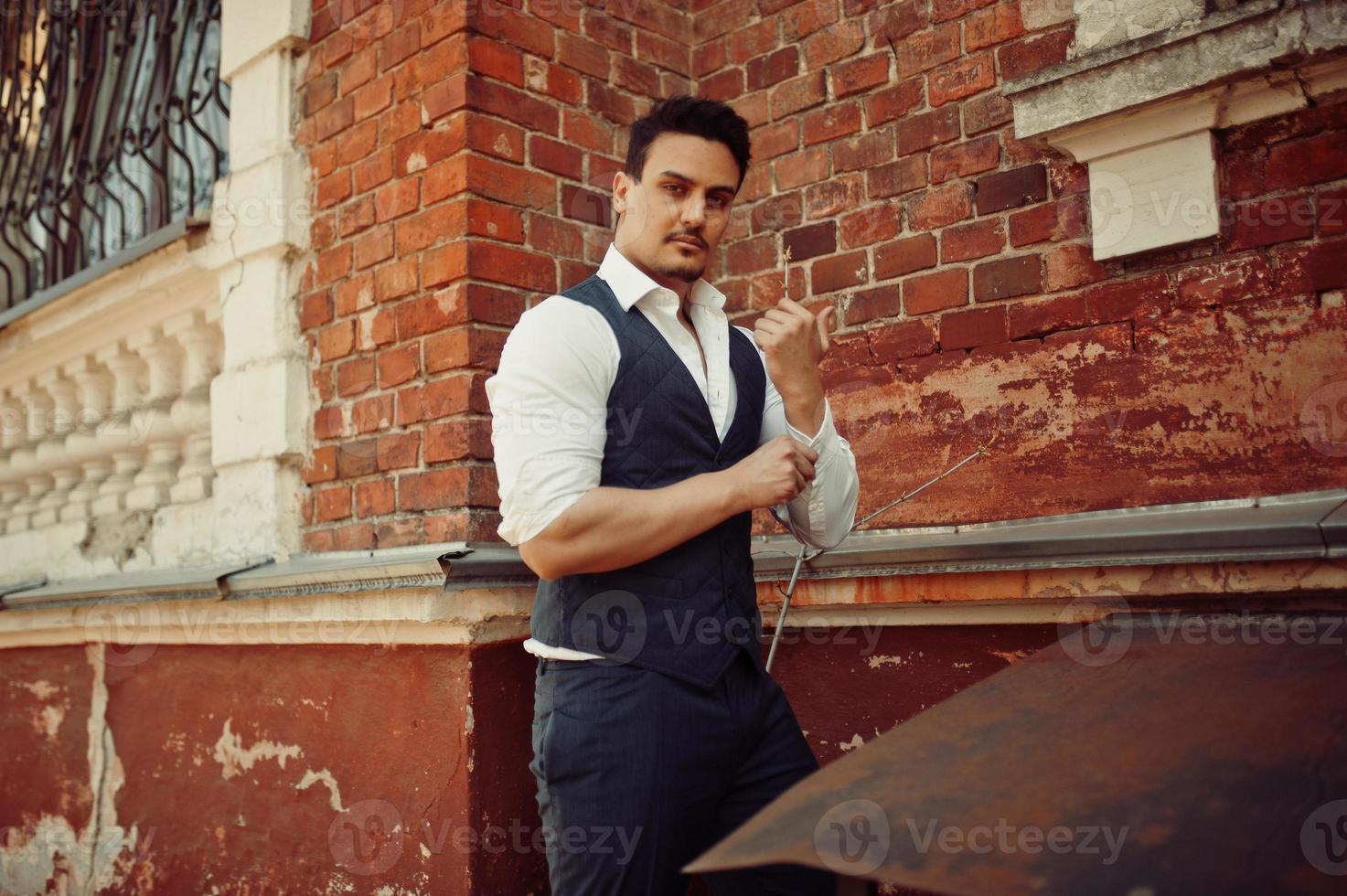 Portrait of retro 1920s english arabian business man wearing waistcoat. photo