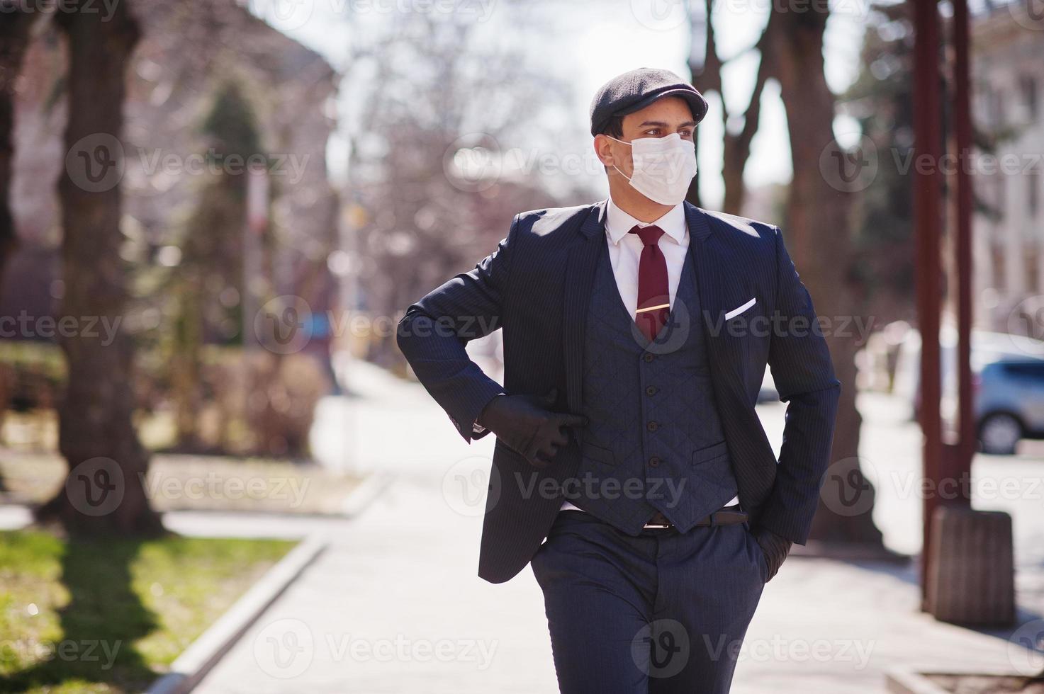 Concept of coronavirus quarantine. Business man wear on suit with medical face mask. MERS-Cov, Novel coronavirus 2019-nCoV photo