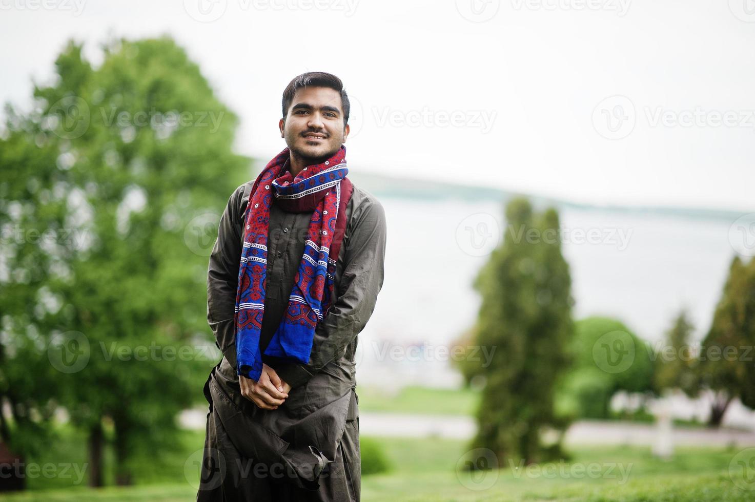 Indo pakistani man wear traditional clothes achkan or sherwani. photo