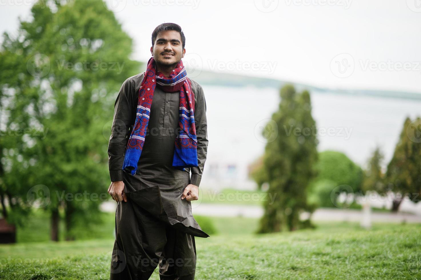 Indo pakistani man wear traditional clothes achkan or sherwani. photo