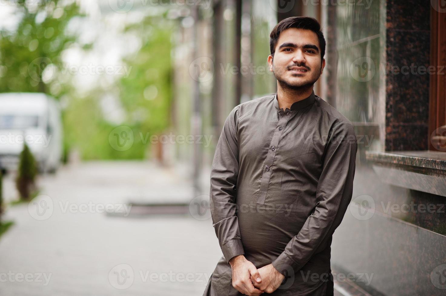 Indo pakistani man wear traditional clothes achkan or sherwani. photo