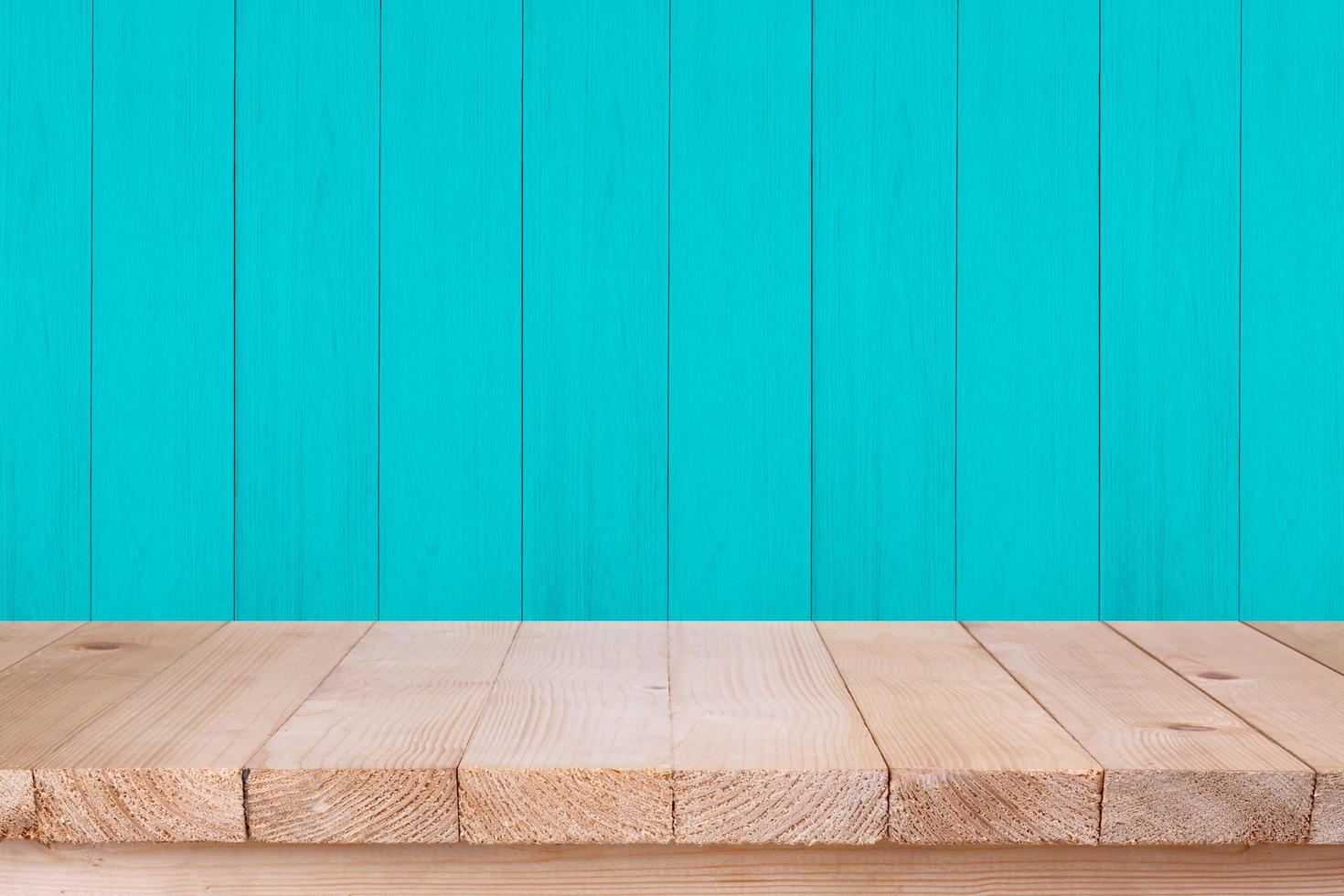 Wood table top on green wood background photo