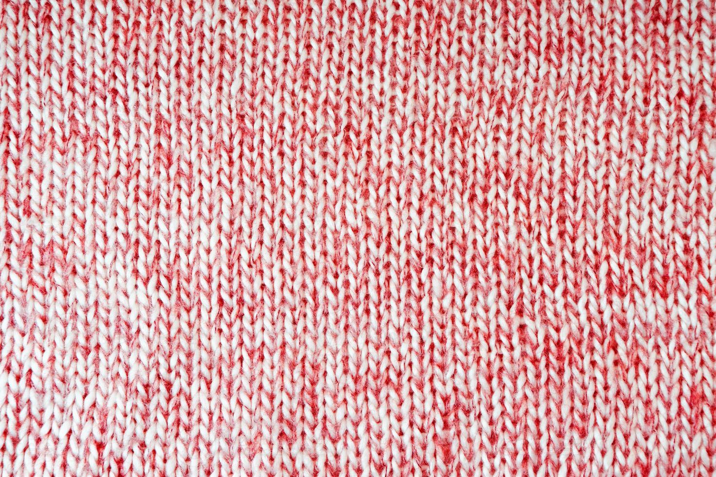 Bright red knitwear wool fabric texture background. Abstract textile backdrop photo
