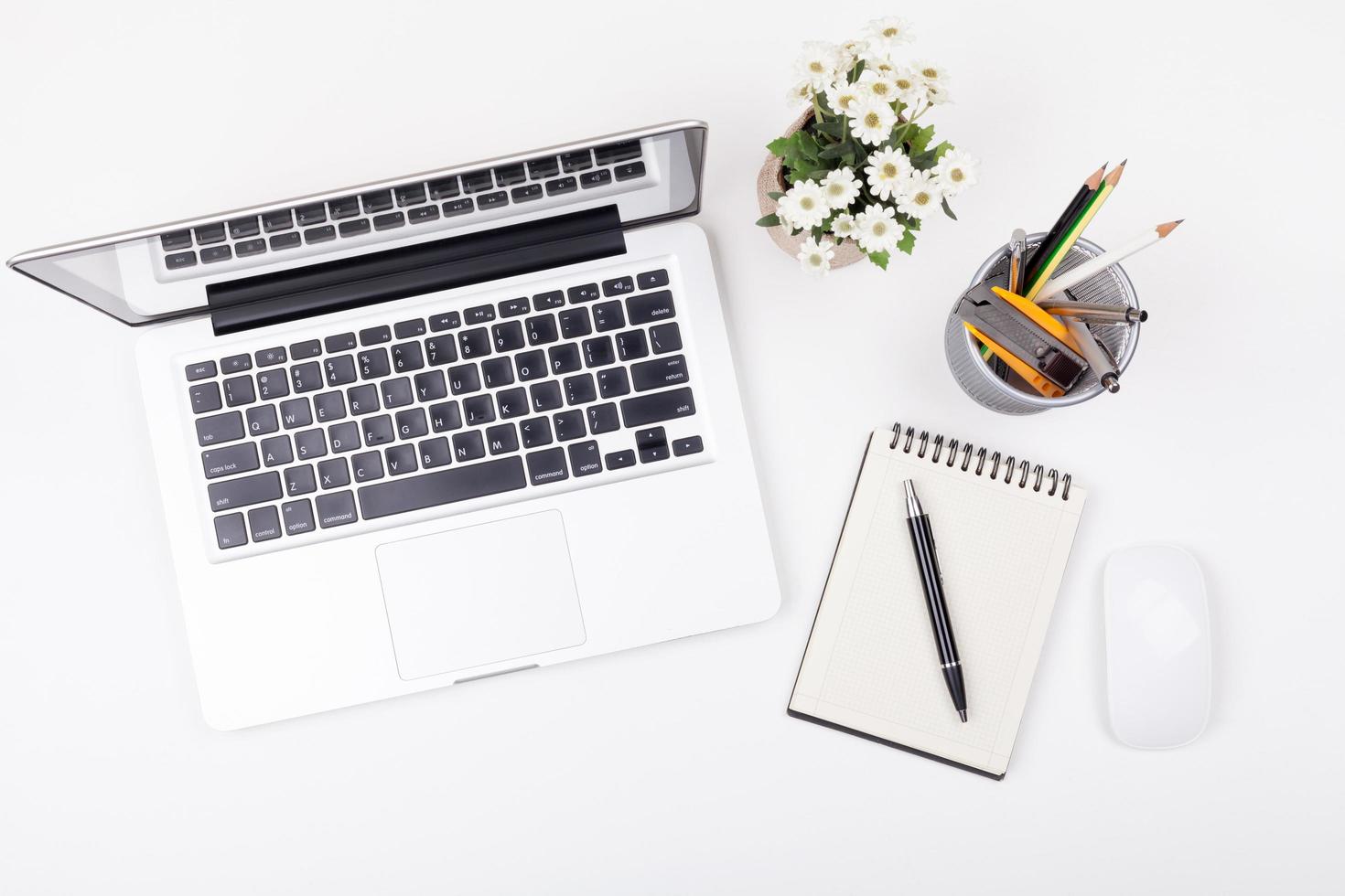 Top view laptop or notebook workspace office and latte coffee on white table photo