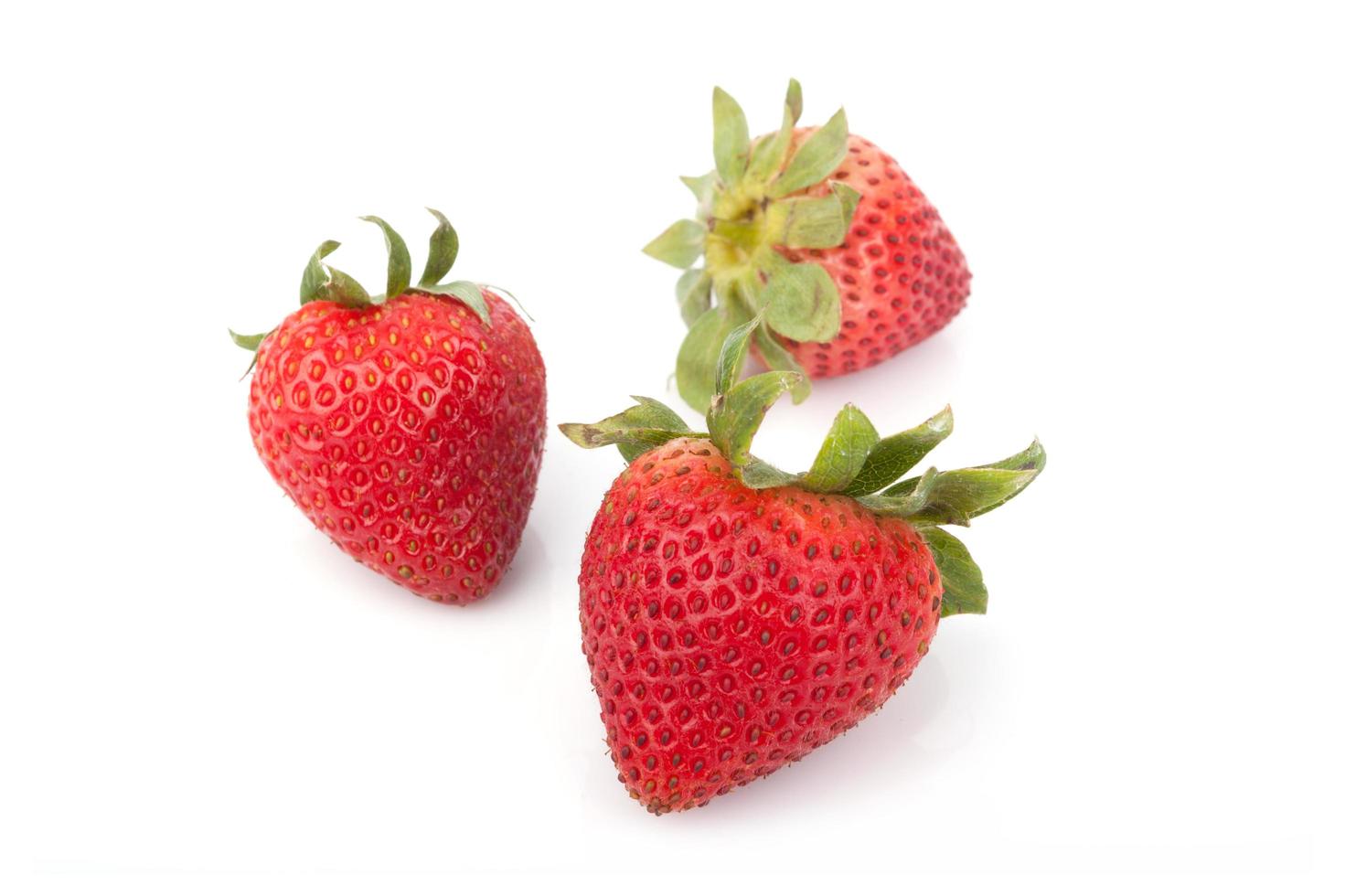 Fresh strawberries on white photo