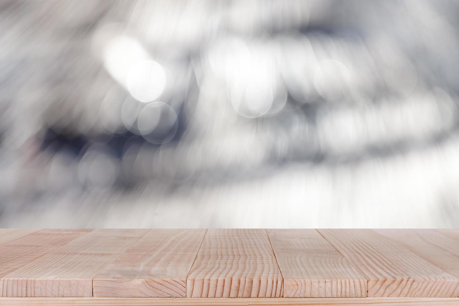 brown wood table top on bokeh abstract white background - can be used for montage or display your products photo