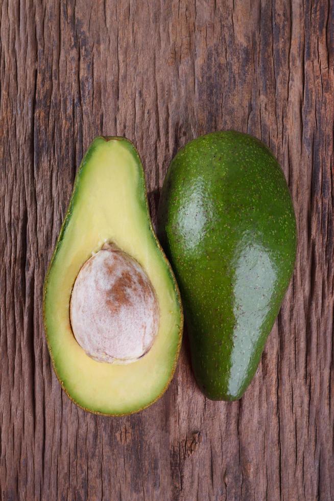 Avocado on a wooden background photo