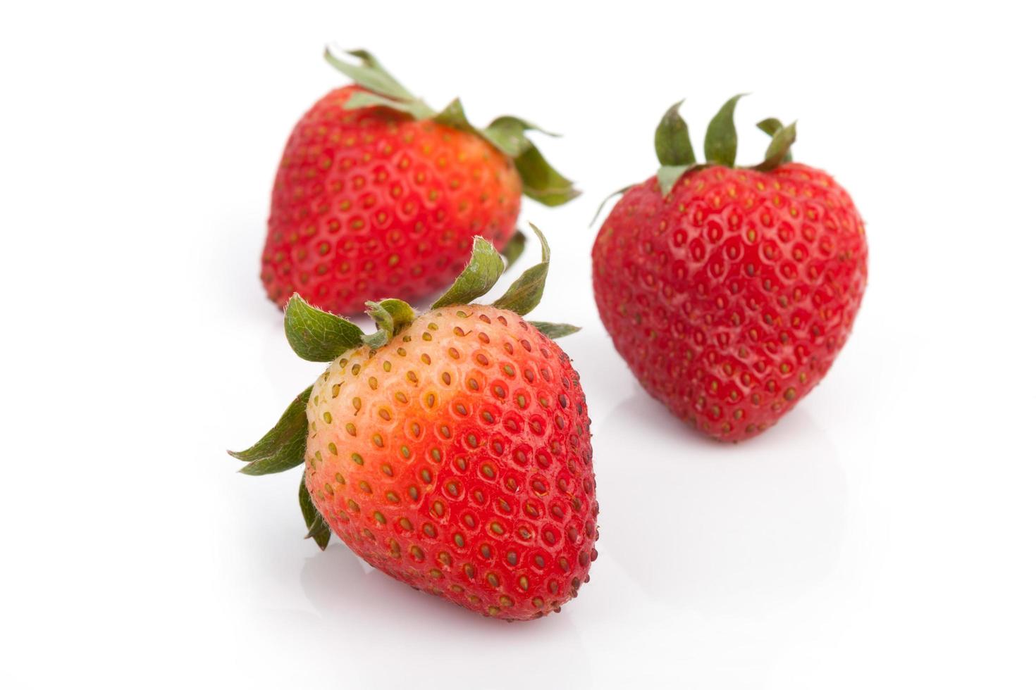 Fresh strawberries on white photo