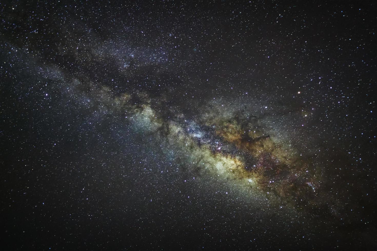 Milky way galaxy with stars and space dust in the universe, Long exposure photograph, with grain. photo