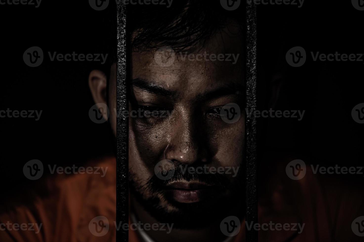 Asian man desperate at the iron prison,prisoner concept,thailand people,Hope to be free,Serious prisoners imprisoned in the prison photo