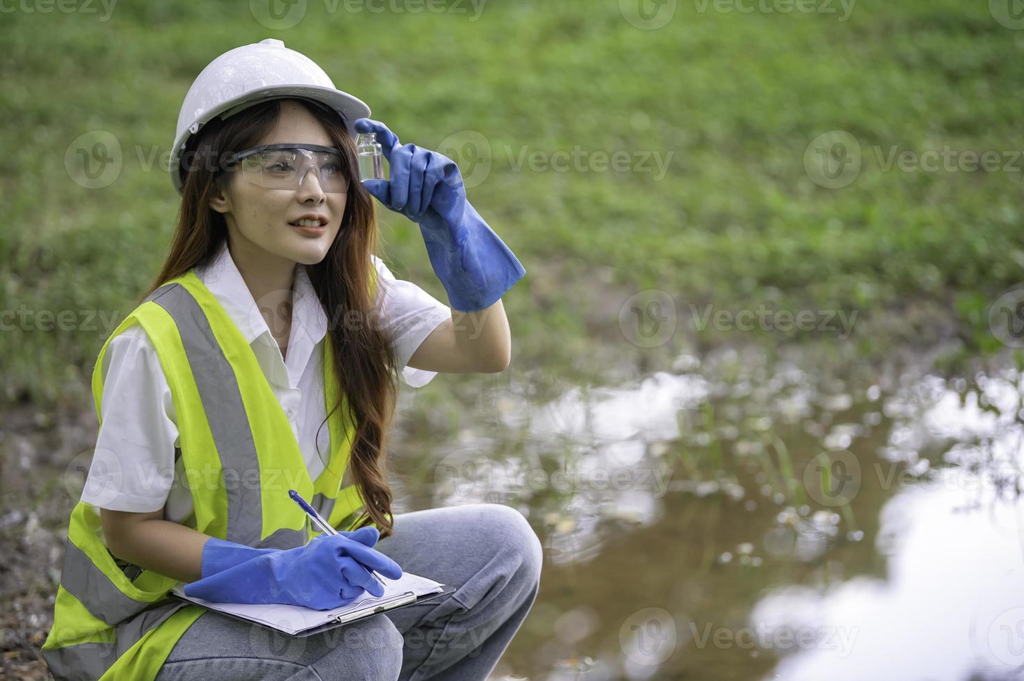 Environmental engineers inspect water quality,Bring water to the lab for testing,Check the mineral content in water and soil,Check for contaminants in water sources. photo