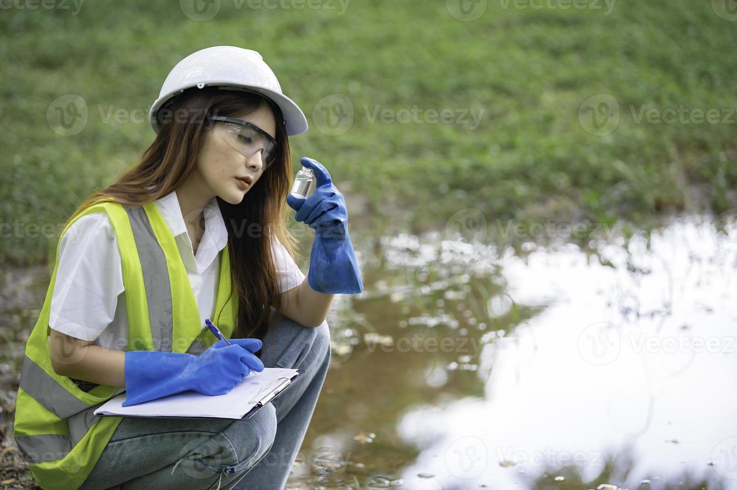 Environmental engineers inspect water quality,Bring water to the lab for testing,Check the mineral content in water and soil,Check for contaminants in water sources. photo