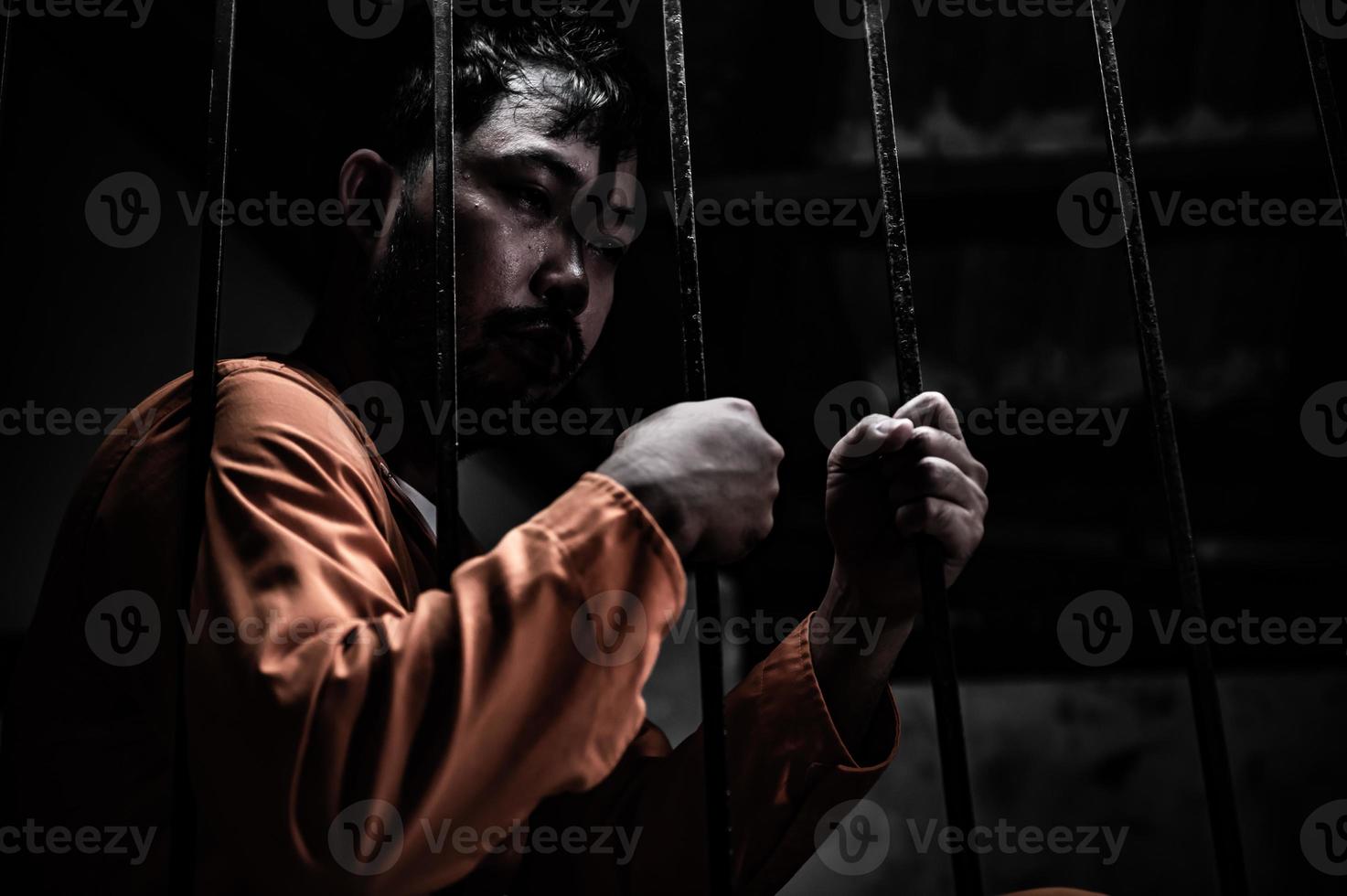 Asian man desperate at the iron prison,prisoner concept,thailand people,Hope to be free,Serious prisoners imprisoned in the prison photo
