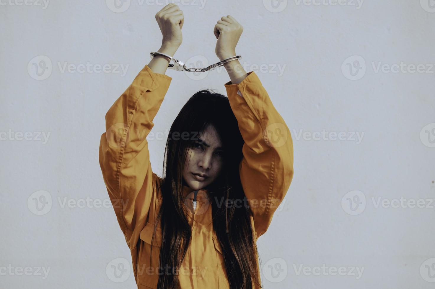 Prisoner in orange robe concept,Portrait of asian woman in Prison uniforms on white background, photo
