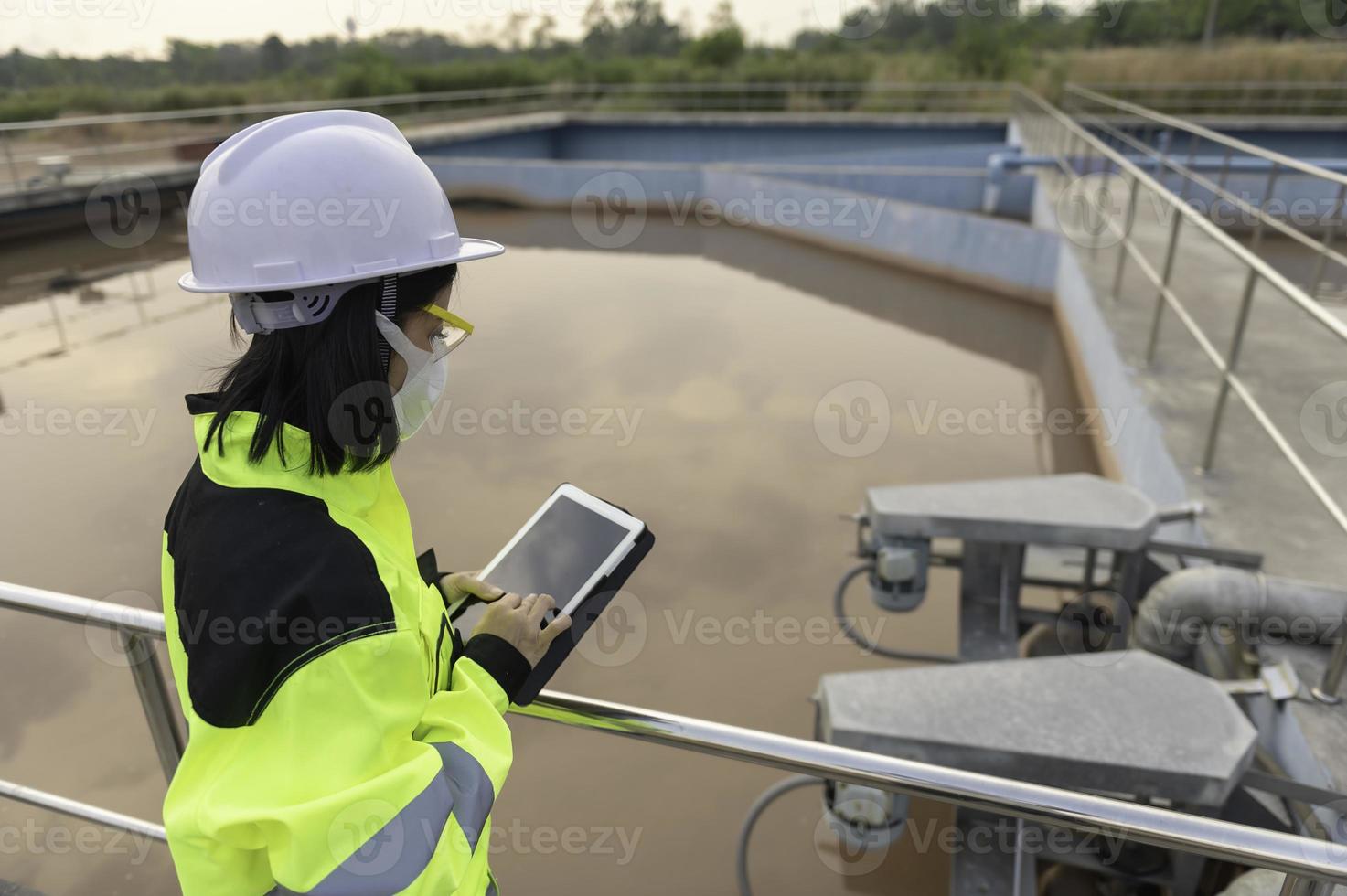 Environmental engineers work at wastewater treatment plants,Water