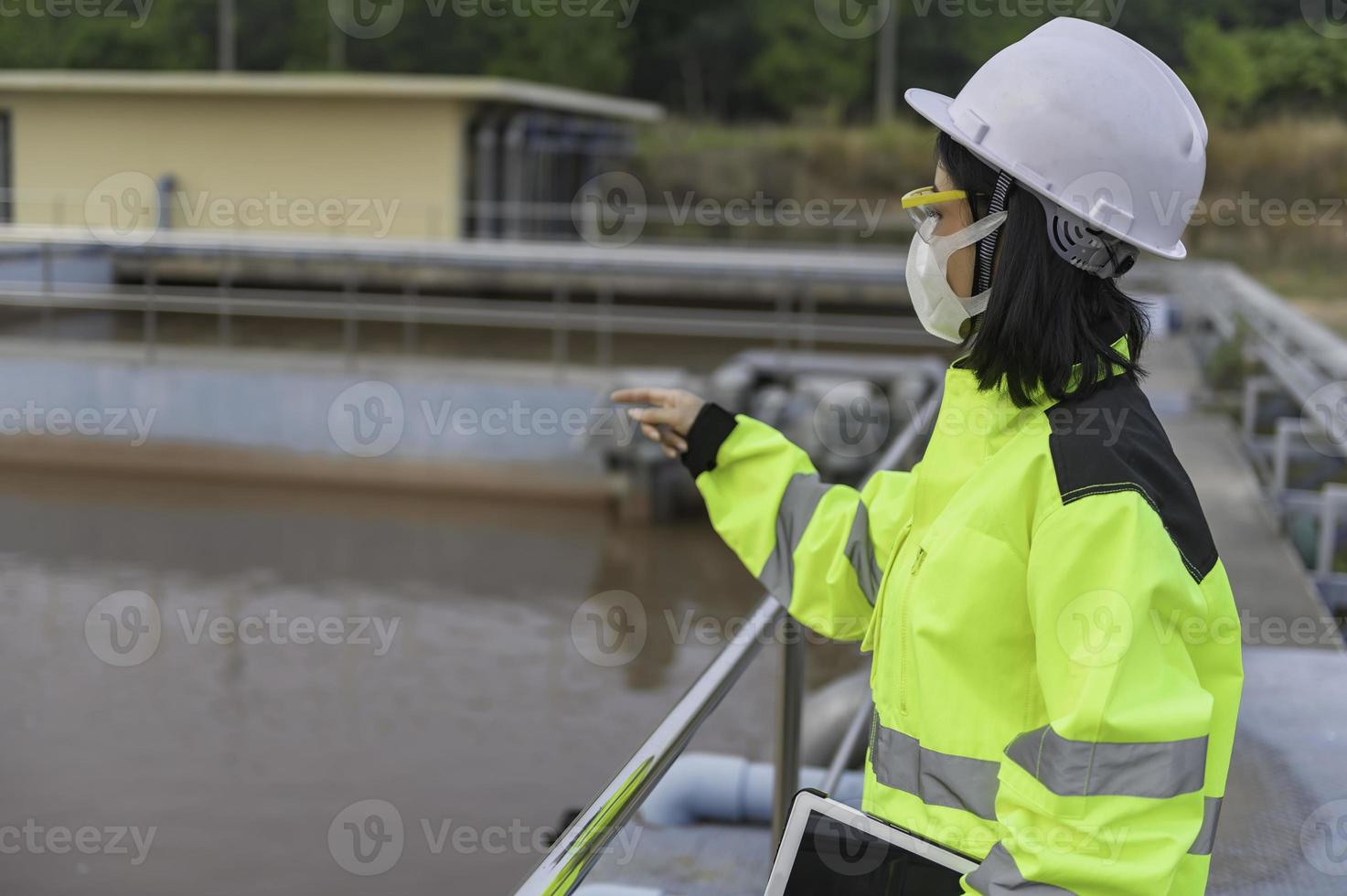 Environmental engineers work at wastewater treatment plants,Water supply engineering working at Water recycling plant for reuse photo