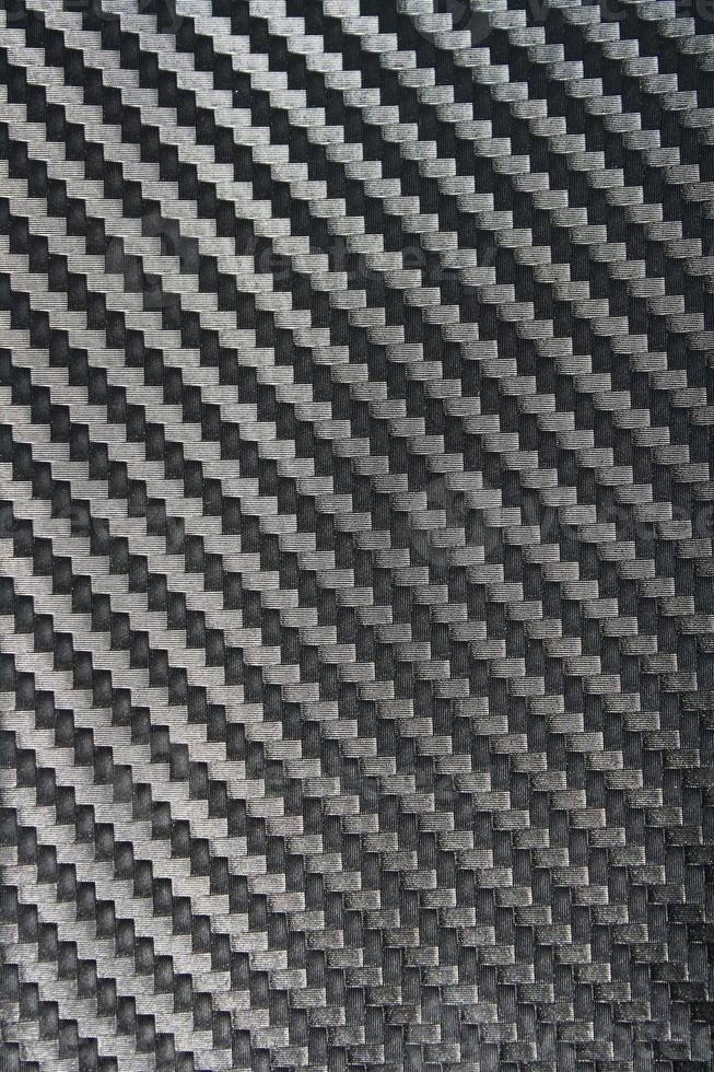 carbon fiber texture. Dark background photo