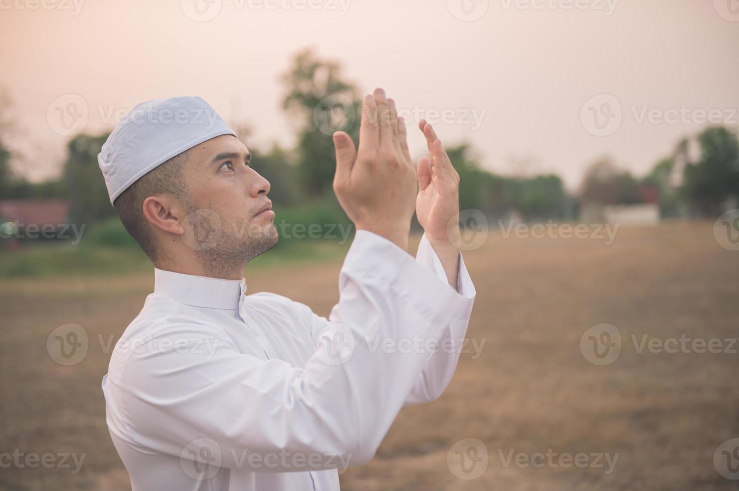 Asian islam man prayer,Young Muslim praying,Ramadan festival concept photo