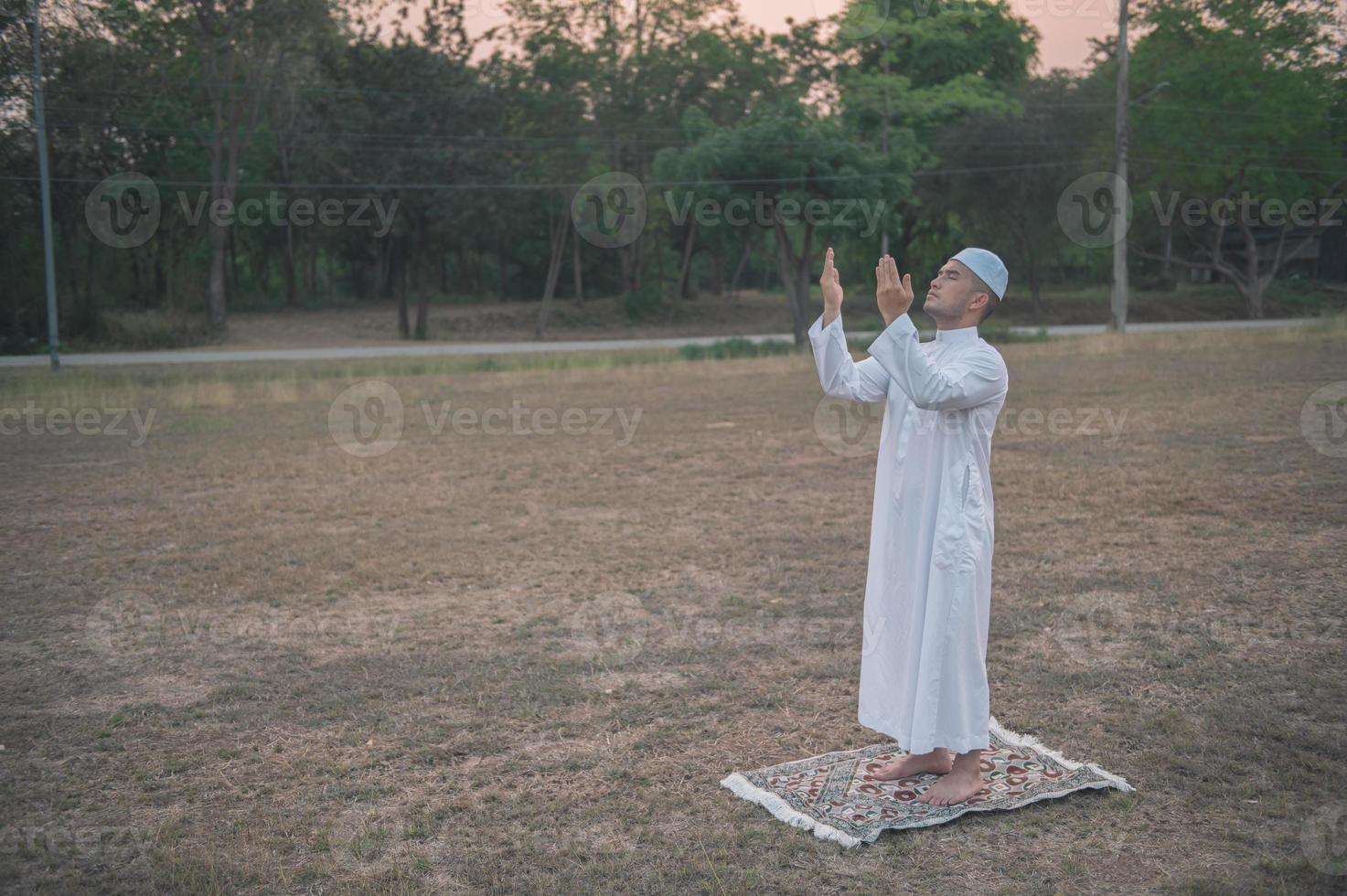 Asian islam man prayer,Young Muslim praying,Ramadan festival concept photo