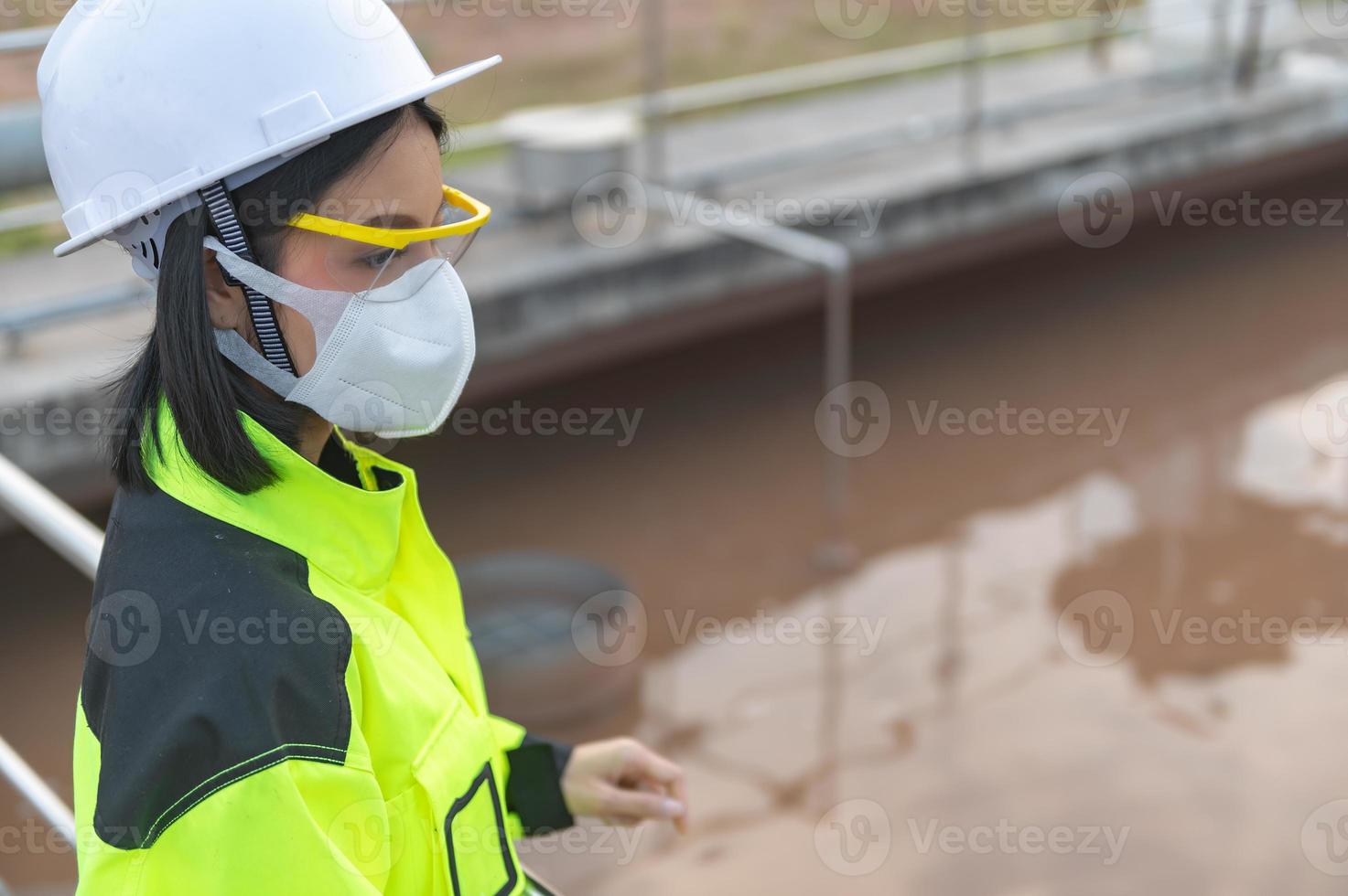 Environmental engineers work at wastewater treatment plants,Water supply engineering working at Water recycling plant for reuse photo